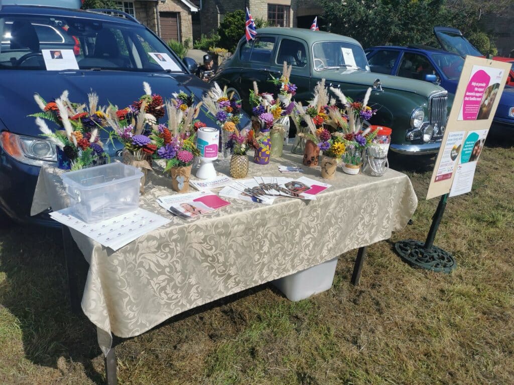 A fundraising stall at a local fair covered in items for sale