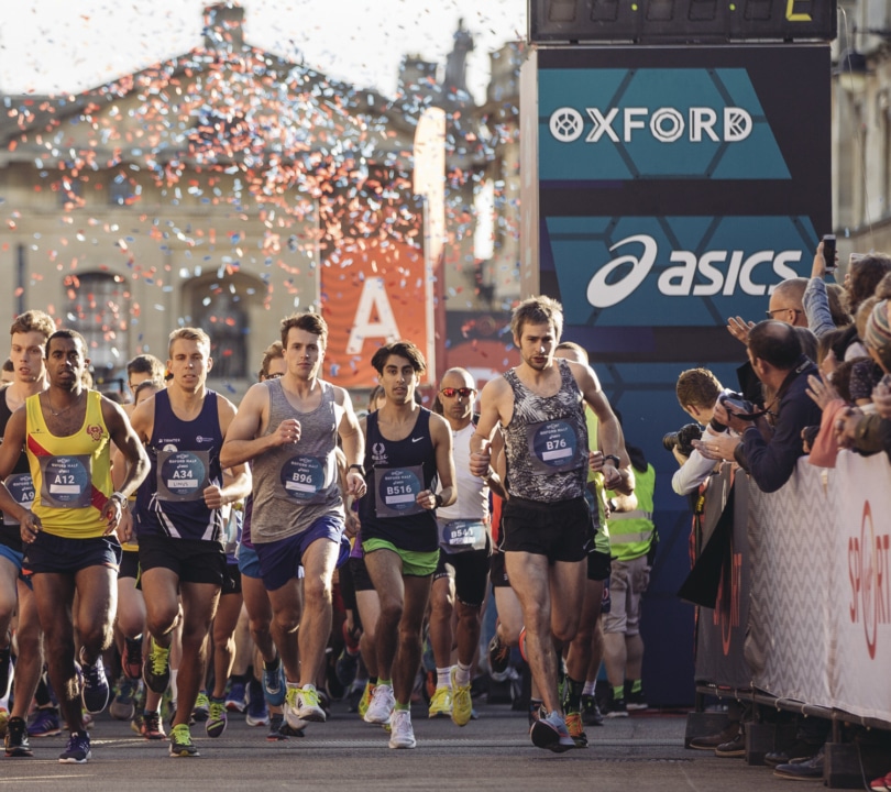 People running through the streets of Oxford.